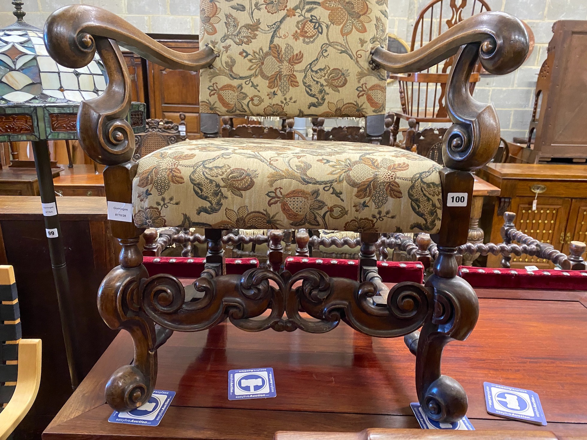 A reproduction Jacobean style mahogany upholstered elbow chair, width 64cm, depth 51cm, height 170cm